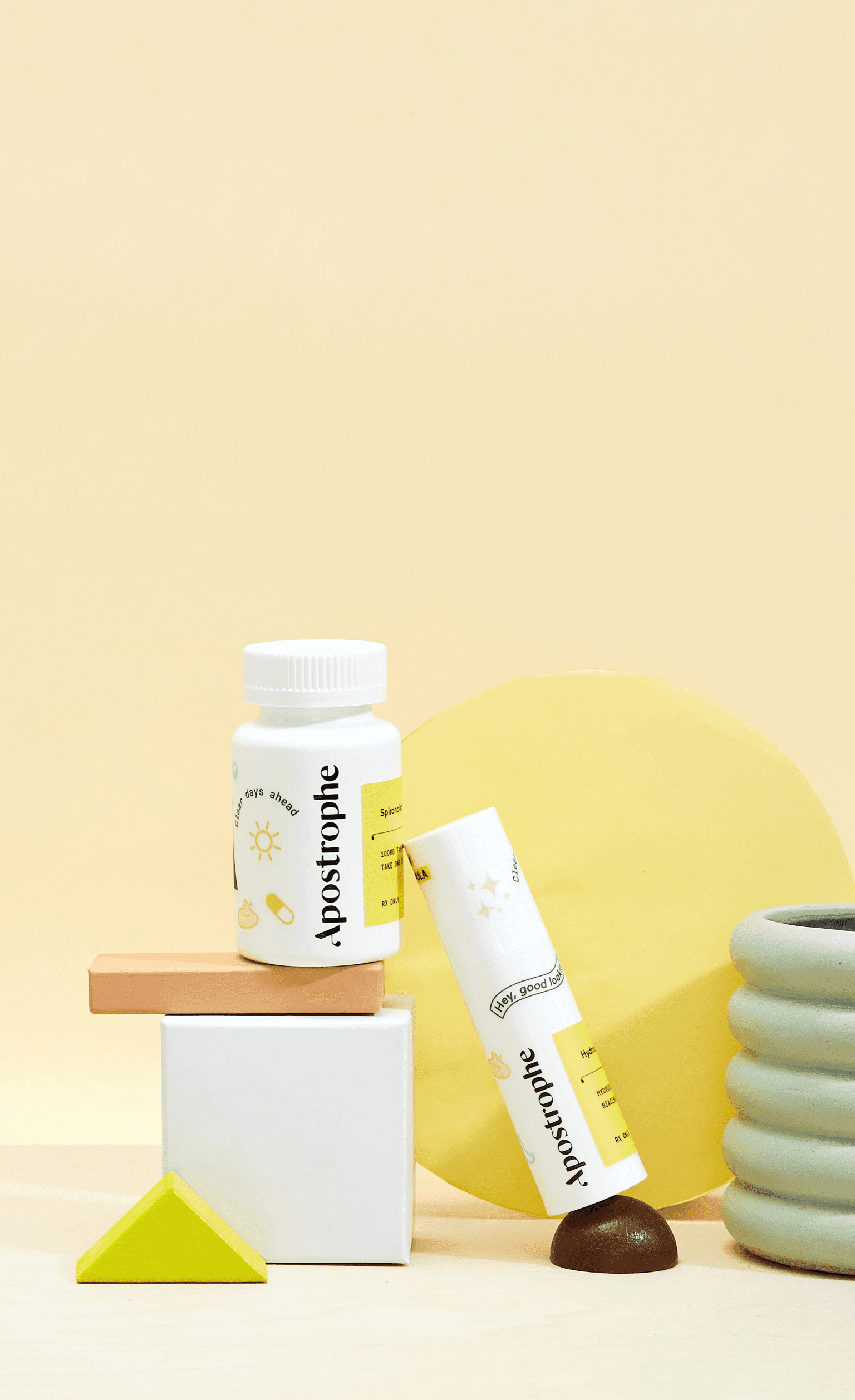 Apostrophe Oral medication and topical medication bottles stacked on shapes
