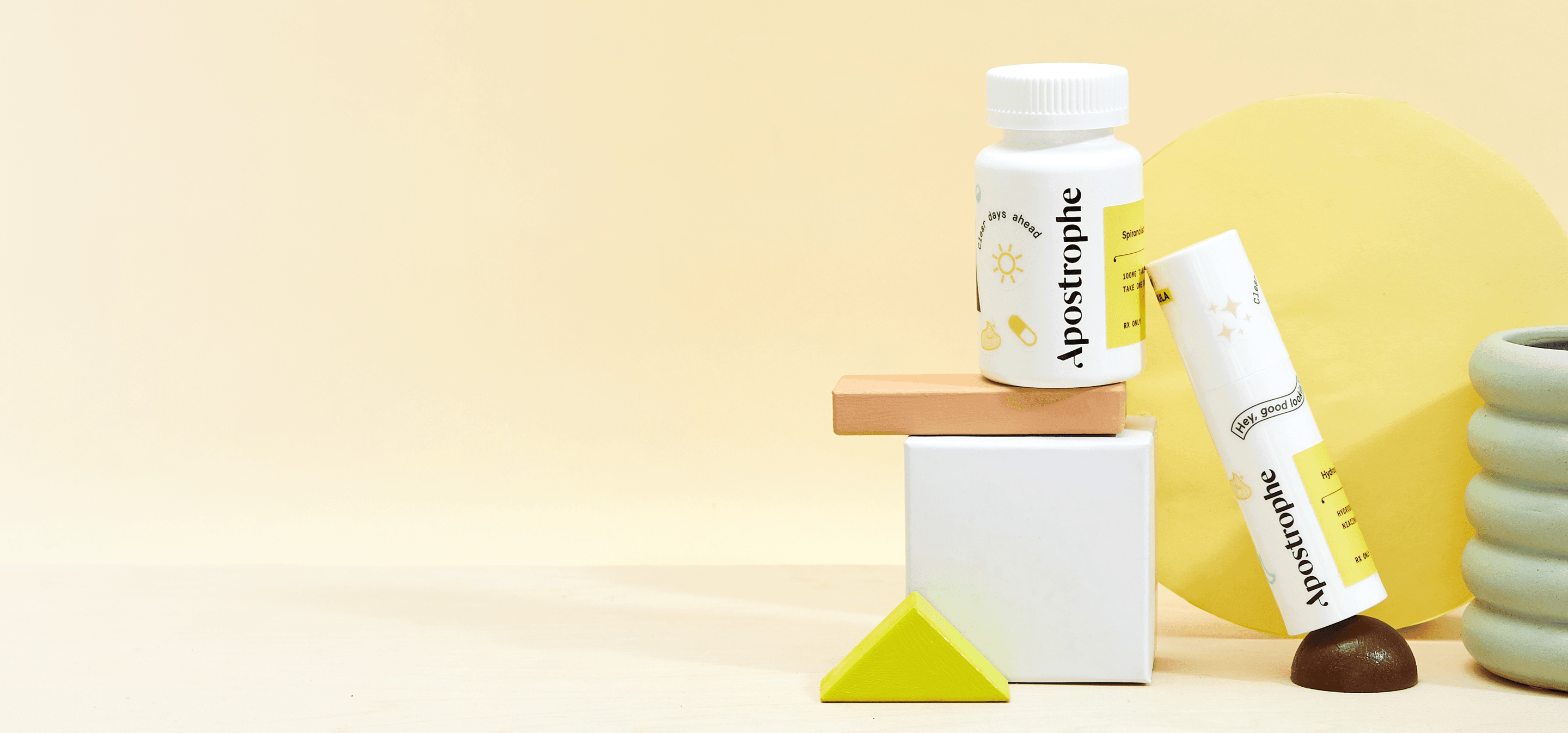 Apostrophe Oral medication and topical medication bottles stacked on shapes